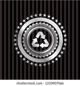 recycle icon inside silvery emblem