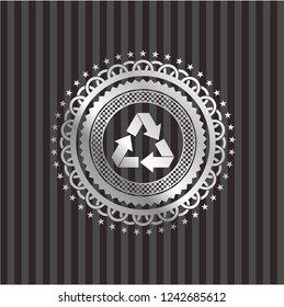 recycle icon inside silvery emblem