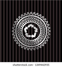 recycle icon inside silvery emblem