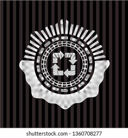 recycle icon inside silvery emblem