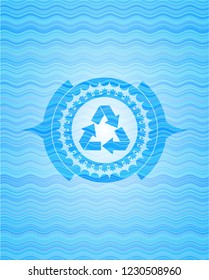 recycle icon inside sky blue water wave style emblem.