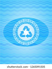 recycle icon inside sky blue water wave badge.