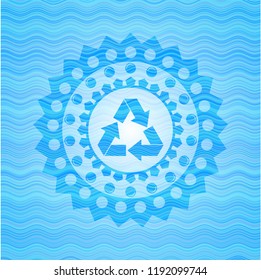 recycle icon inside water concept badge.