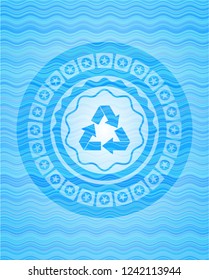 recycle icon inside water wave badge.