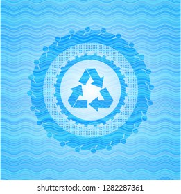 recycle icon inside water wave emblem.