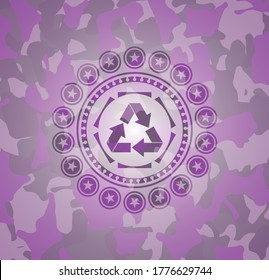 recycle icon on pink and purple camouflaged texture. 