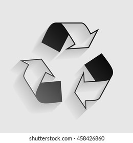 Recycle logo concept. Black paper with shadow on gray background.