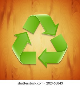 Recycle sign on wood texture. EPS10 vector