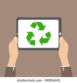 Recycle symbol in tablet, hands hold device
