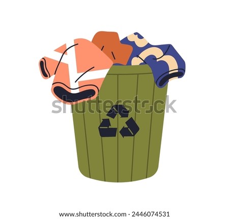 Recycled clothes in waste bin. Eco-friendly reusable textile in container. Used apparel donation, recyclable garments, items for reusing. Flat vector illustration isolated on white background