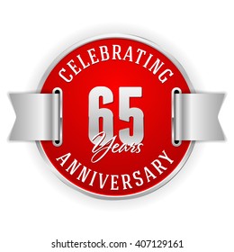 Red 65 years anniversary badge with silver border and ribbon