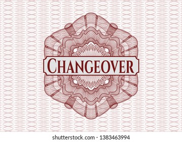 Red abstract rosette with text Changeover inside