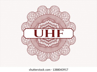 Red abstract rosette with text UHF inside