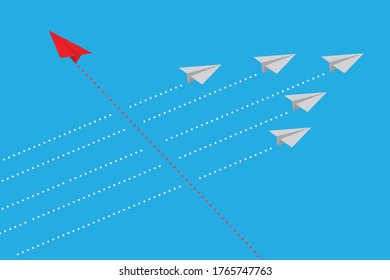 Red airplane changing direction among white ones, symbolizing new ideas, change, trends, courage, creative solutions, innovation, and the concept of taking a unique path