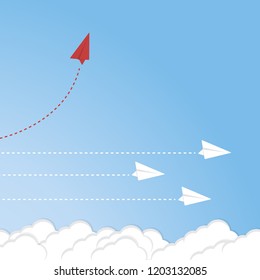 Red airplane changing direction and white ones. New idea, change, trend, courage, creative solution, innovation and unique way concept.