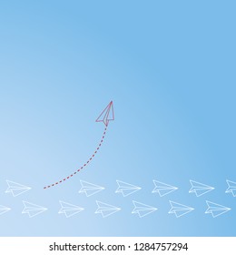 Red airplane changing direction and white ones. New idea, change, trend, courage, creative solution, innovation and unique way concept.