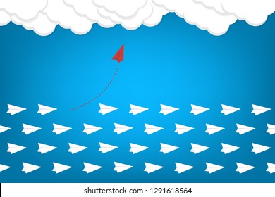 Red airplane changing direction and white ones. New idea, change, trend, courage, creative solution, innovation and unique way concept.