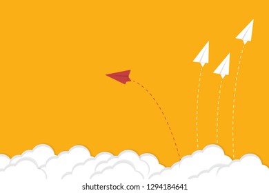 Red airplane changing direction and white ones. New idea, change, trend, courage, creative solution, innovation and unique way concept.