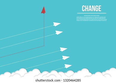 Red airplane changing direction and white ones 