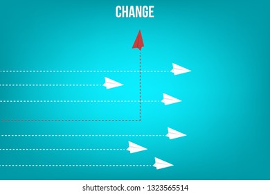 Red airplane changing direction and white ones. New idea, change, trend, courage, creative solution, innovation and unique way concept. 