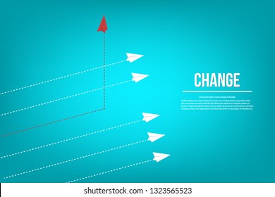 Red airplane changing direction and white ones. New idea, change, trend, courage, creative solution, innovation and unique way concept. 
