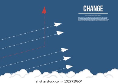 Red airplane changing direction and white ones. New idea, change, trend, courage, creative solution, innovation and unique way concept.