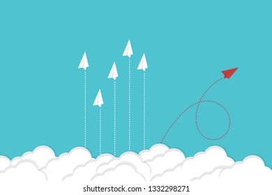 Red airplane changing direction and white ones. New idea, change, trend, courage, creative solution, innovation and unique way concept.