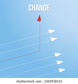 Red airplane changing direction and white ones. New idea, change, trend, courage, creative solution, innovation and unique way concept.