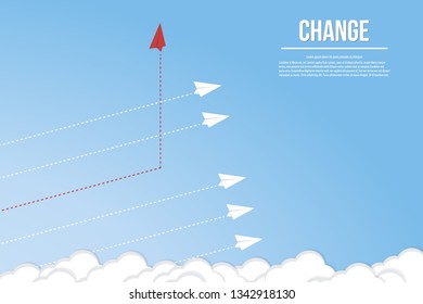 Red airplane changing direction and white ones. New idea, change, trend, courage, creative solution, innovation and unique way concept.
