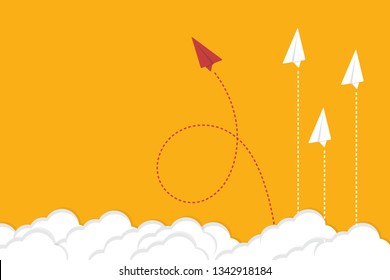 Red airplane changing direction and white ones. New idea, change, trend, courage, creative solution, innovation and unique way concept.