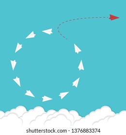 Red airplane changing direction and white ones. New idea, change, trend, courage, creative solution, innovation and unique way concept.