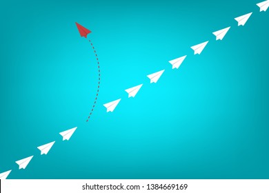 Red airplane changing direction and white ones. New idea, change, trend, courage, creative solution, innovation and unique way concept.