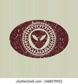 Red alien icon inside distress grunge style stamp