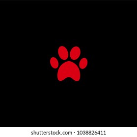 Red animal pawprint icon isolated on black  background. Vector illustration, sign, symbol, logo, clip art. 