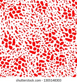 Red animal skin leopard pattern on white background. Seamless background with random black elements. Abstract ornament.