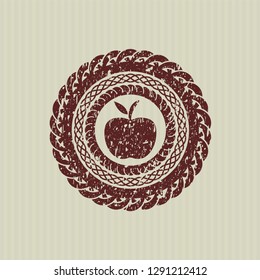 Red apple icon inside distressed rubber stamp with grunge texture