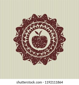 Red apple icon inside rubber grunge texture seal