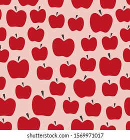 Red apple retro seamless pattern. Simple repeat design with pink background for textile printing or wallpaper.