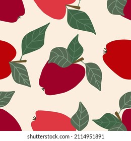 Manzanas rojas con hojas y ramas en un fondo beige, ilustración vectorial, patrón sin fisuras. Dibujo manual.