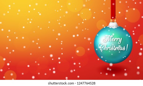 Red background with a large blue Christmas ball and the inscription Merry Christmas. Wide screen