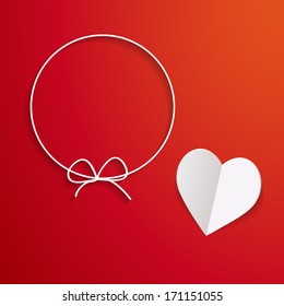 red background with a paper heart and a paper frame