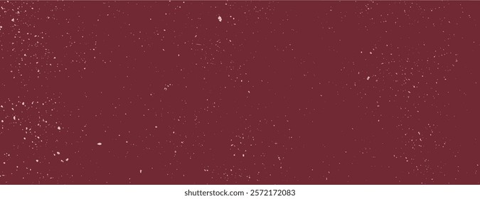 Red background with a speckled texture, creating a starry effect. The red background adds depth and interest with its scattered white specks. Speckled wall texture background. Red background vector.