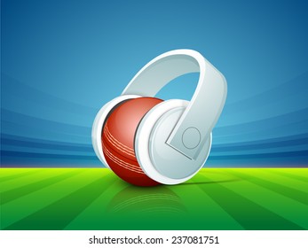 Red ball with headphone for sports of cricket concept on stadium background.