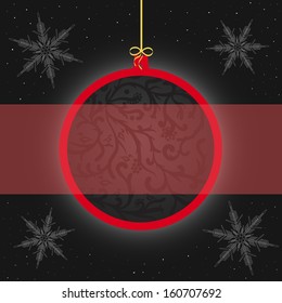 Red ball with a pattern on a Christmas card.
