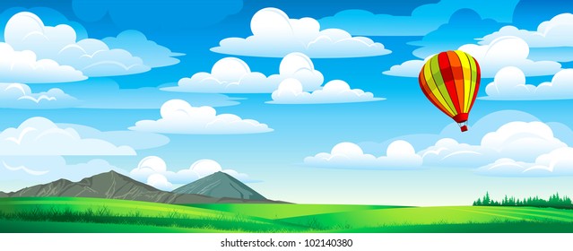 Red balloon on a blue cloudy sky and green meadow with mountains and forest