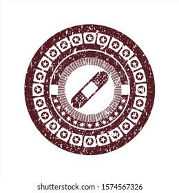 Red bandage plaster icon inside distress rubber grunge stamp