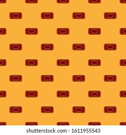 Red Bar of soap with foam icon isolated seamless pattern on brown background. Soap bar with bubbles.  Vector Illustration