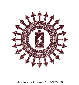 Red battery charging icon inside distressed rubber stamp with grunge texture