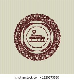 Red bench press icon inside distressed rubber grunge stamp