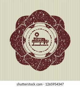 Red bench press icon inside distress grunge style stamp